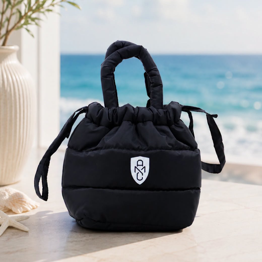 black drawstring bag with white logo patch