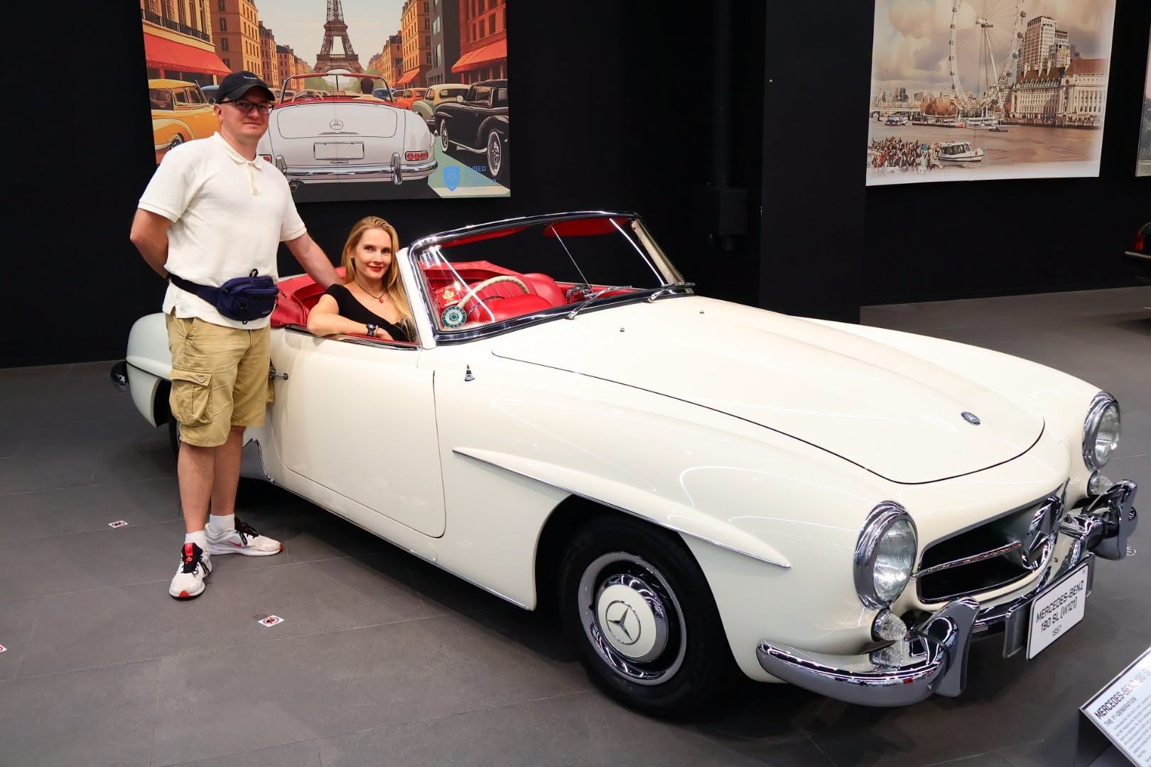 white convertible with red interior in museum